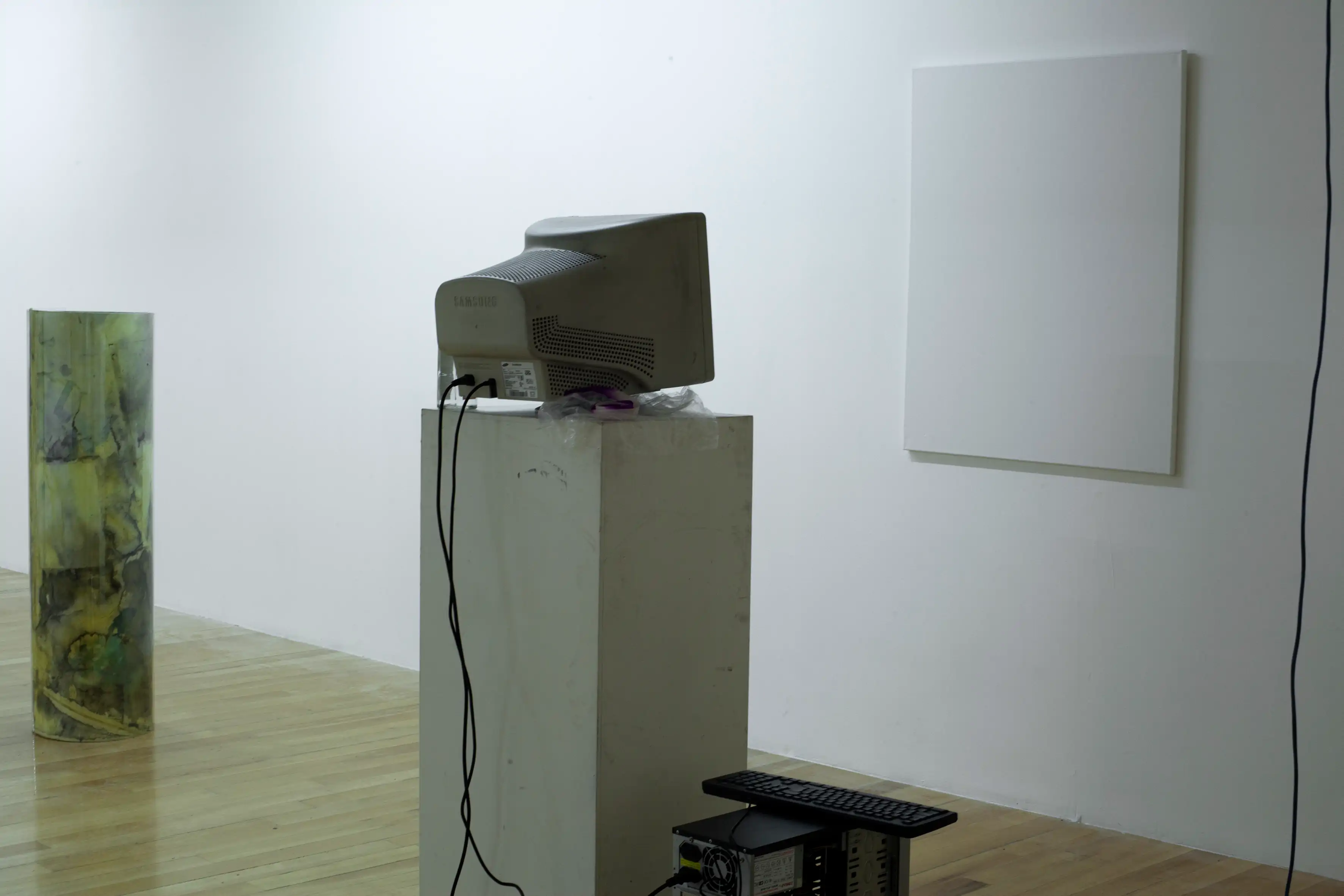 Installation view from one of the sculpture, close to the sculpture from Ezequiel Azambuya that consists from a desktop computer on a pedestal in front of an empty canvas, to show a bit of how the works were seen beside each other