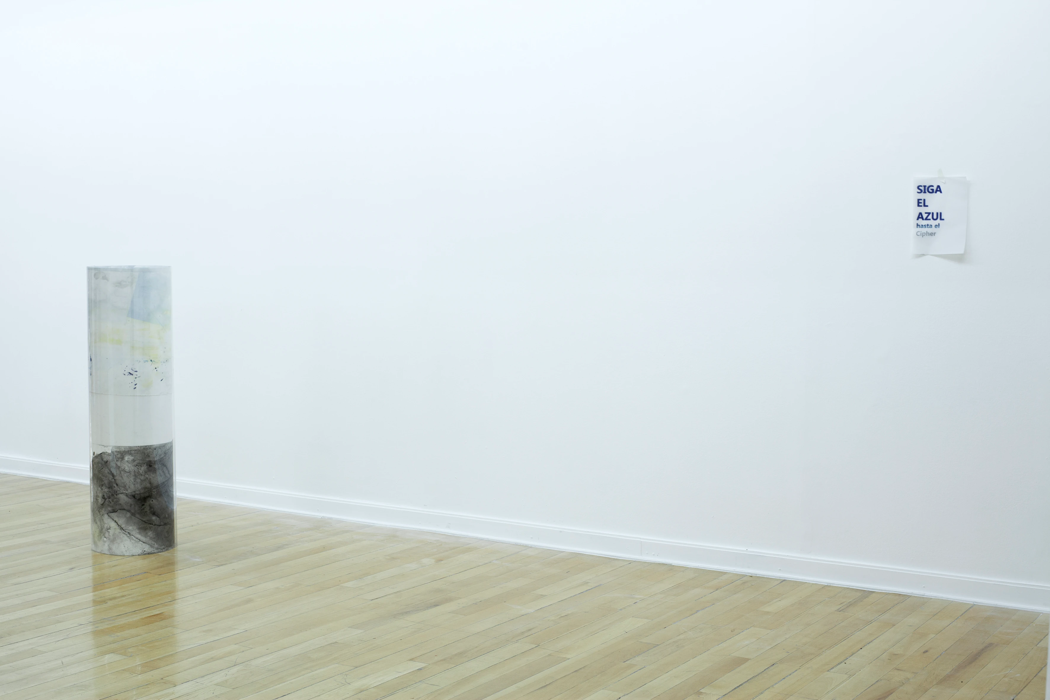 Installation view from one of the sculpture, close to an a4 sign saying Siga el Azul (Follow the blue) from Gala Berger